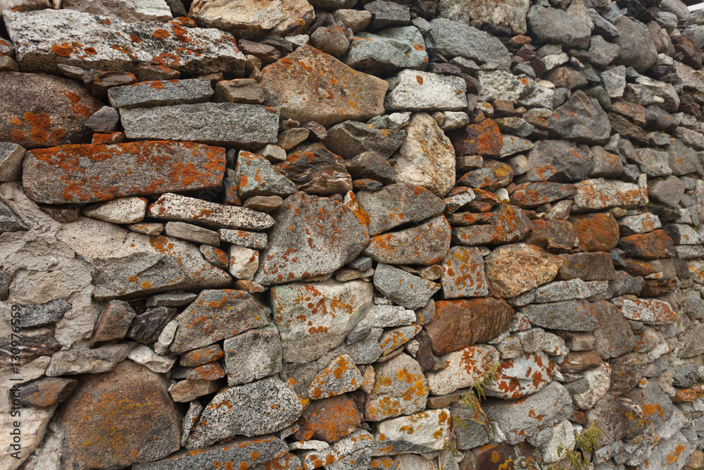 Fototapeta premium a wall built up with stones