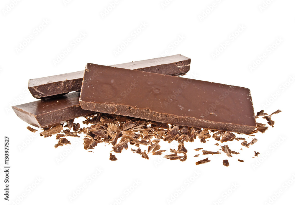 Heap of chocolate shavings and slices on white background Heap of chocolate shavings and slices on white background