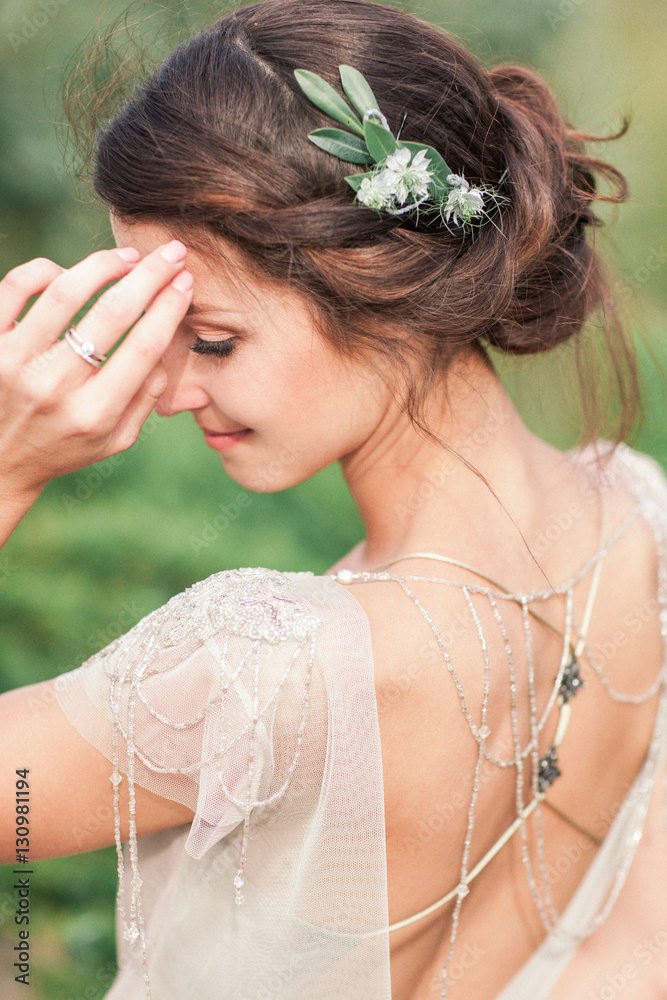 Bride in the park. The girl is turned, dancing. The hair of the