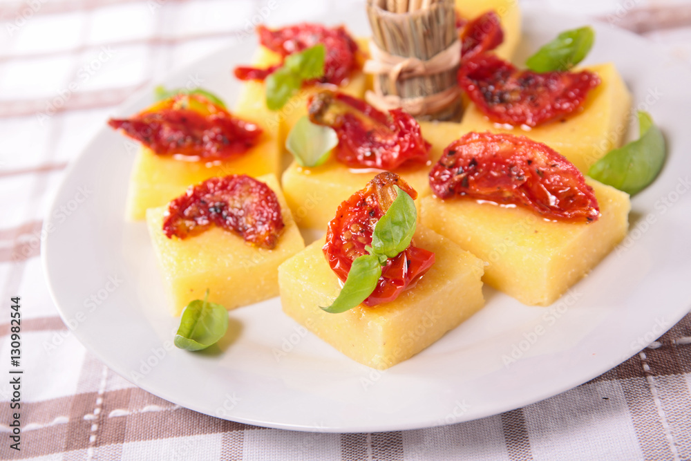 appetizer,polenta with dry tomato and basil