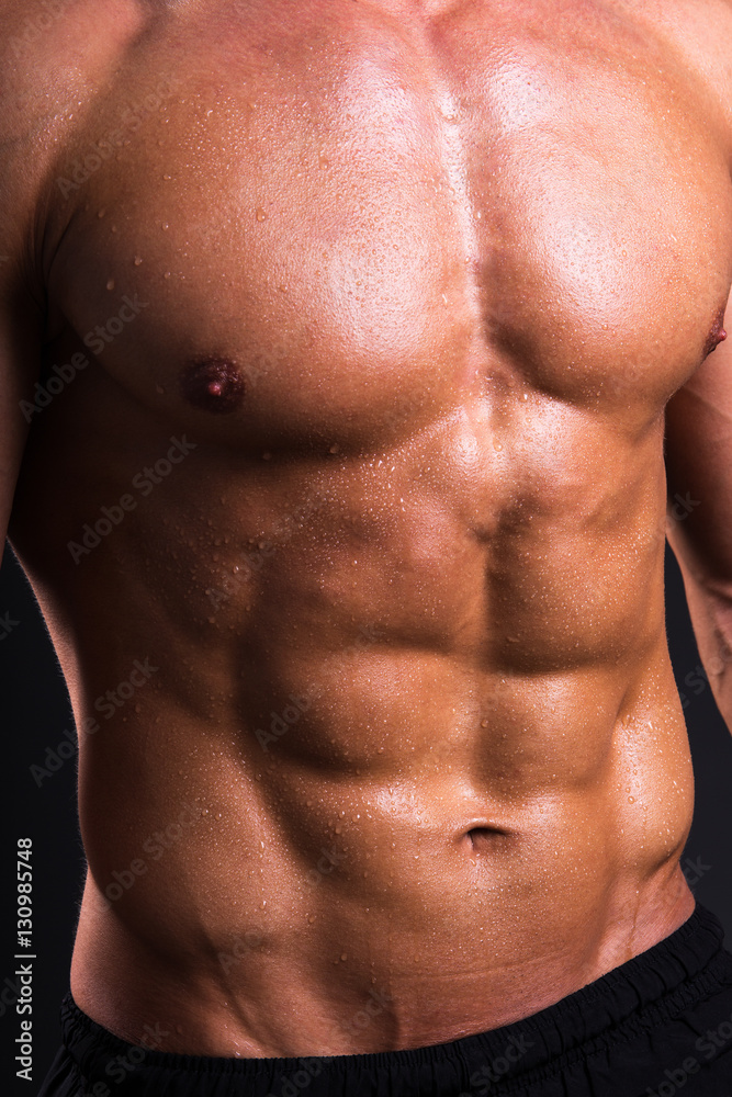 close up of sweat body of muscular man