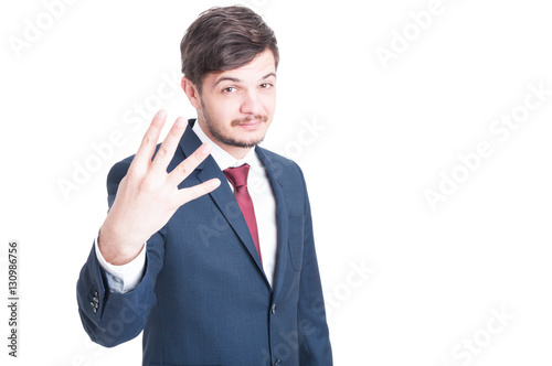 Sales man showing number four with one hand