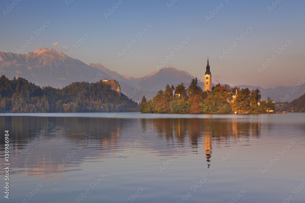Sunset over the church and lake in Bled, Slovenia