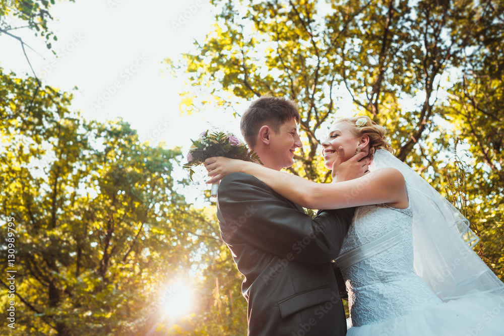 bride and groom on the forest background bride and groom on the forest background