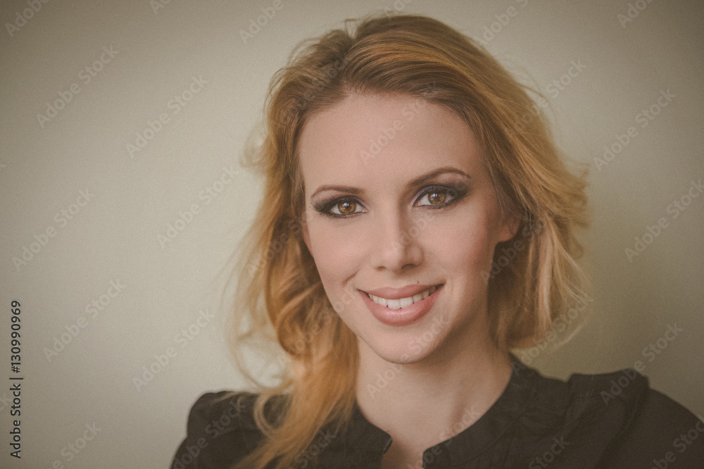 Obraz premium Woman model with professional daily make up on beige background.