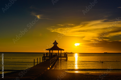 gazebo bridge sea at sunset