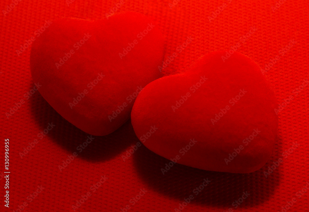 Obraz premium Two red Hearts on red background. For Valentine's day