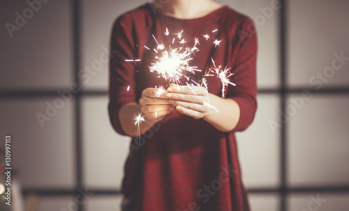 Woman Holding Sparklers photo