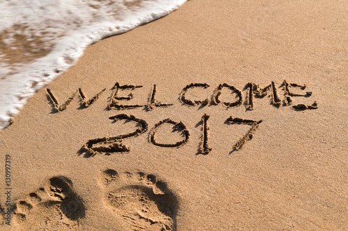 text welcome 2017 in the sand of a beach
