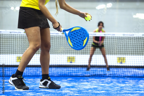 Φωτογραφία Two young women playing paddle tennis.