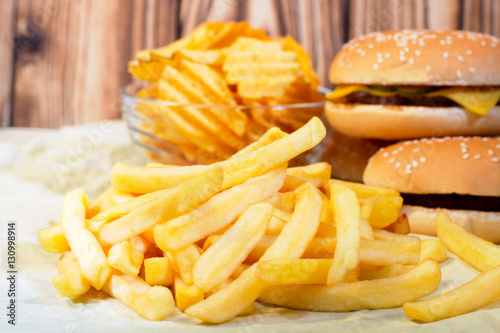 French fries with cheeseburger and chips