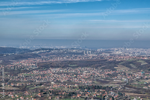 View on the city with nice partially cloudy blue sky © bojandimic