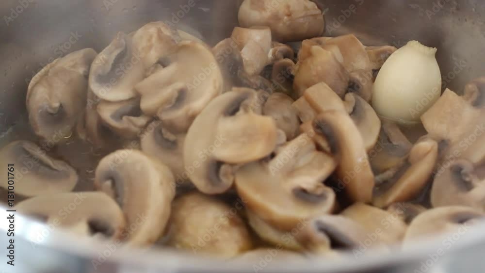 preparation of champignons in a pan with oil and garlic preparation of champignons in a pan with oil and garlic