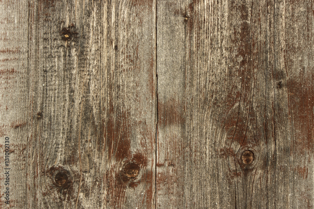 Naklejka premium Texture. Background. Two aging brown wooden planks with knots