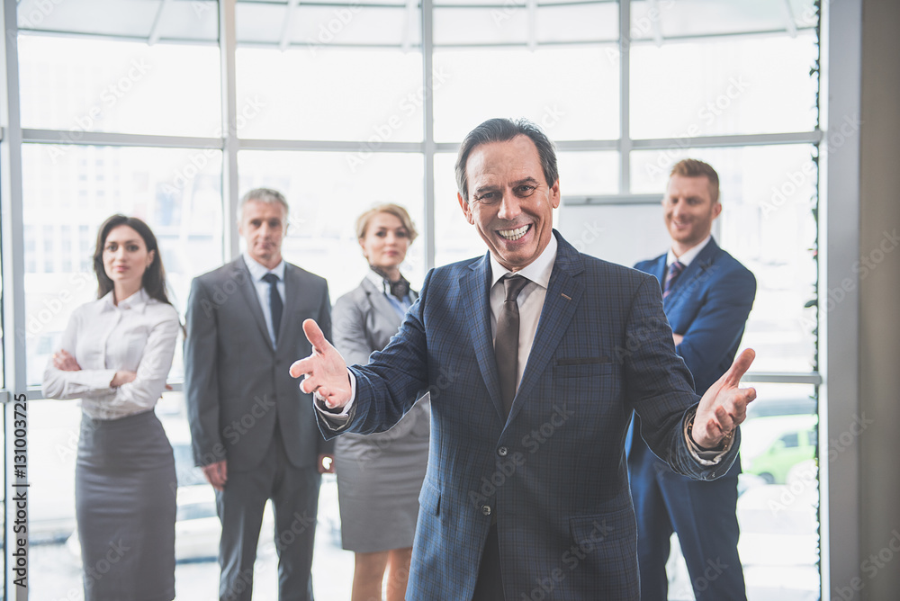 Group of colleagues is standing at office Group of colleagues is standing at office