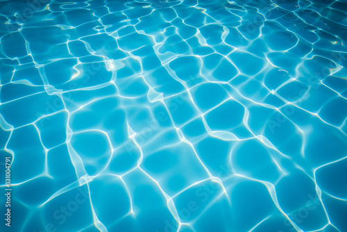 Beautiful blue water surface and ripple wave in swimming pool