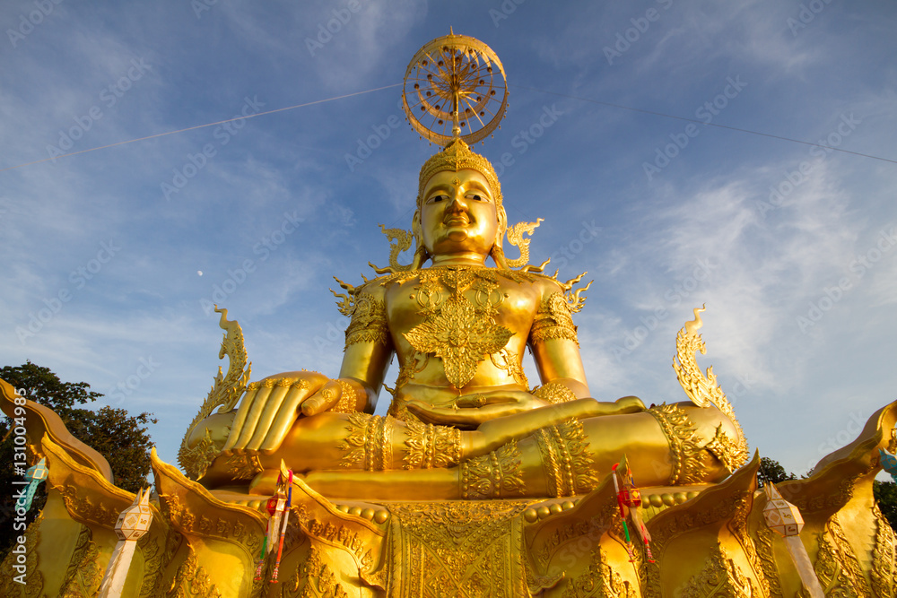 Golden Buddha Image with blue sky