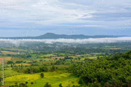 Beautiful view of green field and clouds on the mountain