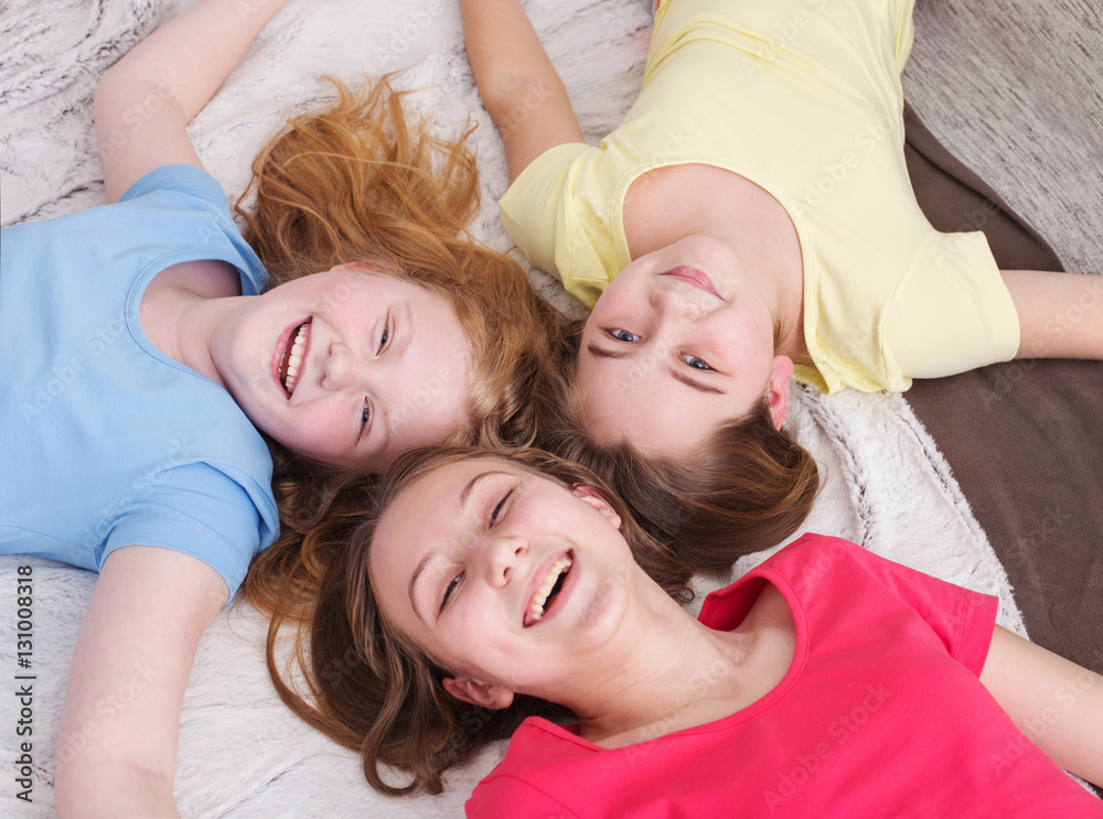 three happy girls at home