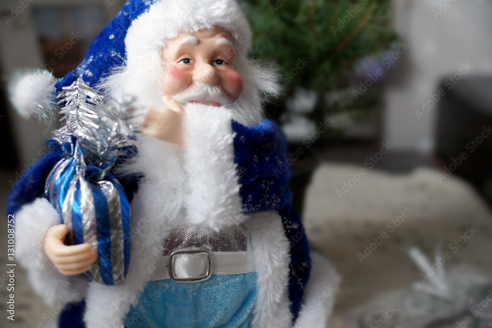 Santa Claus in a blue coat with a bag with gifts Santa Claus in a blue coat with a bag with gifts