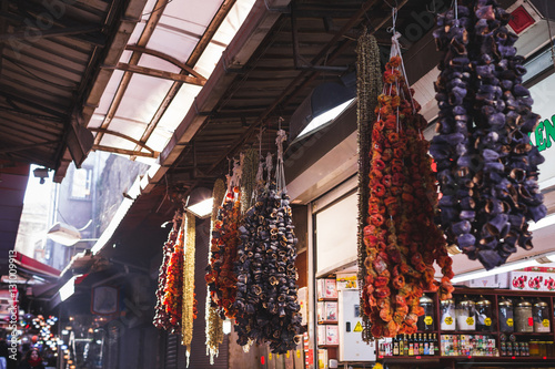 Dried fruits and vegetables sold in the market, hanging on the c photo