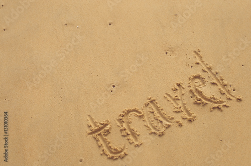 Copy space of travel words on sand beach texture background. © tonktiti
