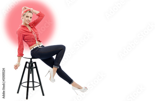 beautiful blonde woman in retro style sitting on stool