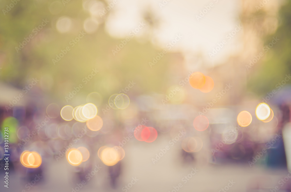 Blur traffic road and colorful bokeh light with sun light abstract background.