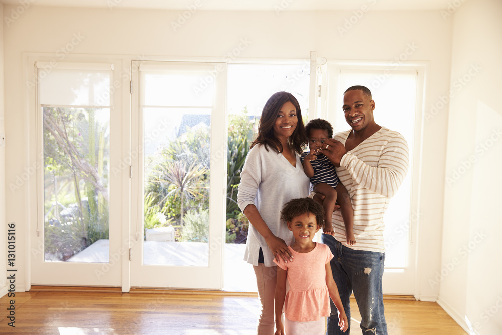 Portrait Of Family In New Home On Moving Day Portrait Of Family In New Home On Moving Day