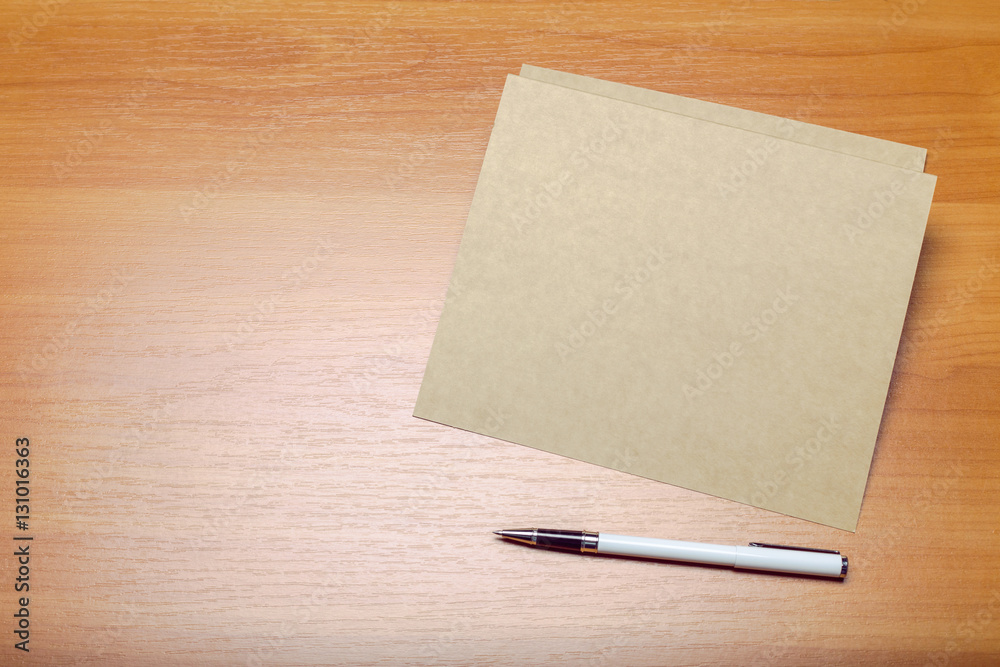Photo of blank envelope on a  wooden background