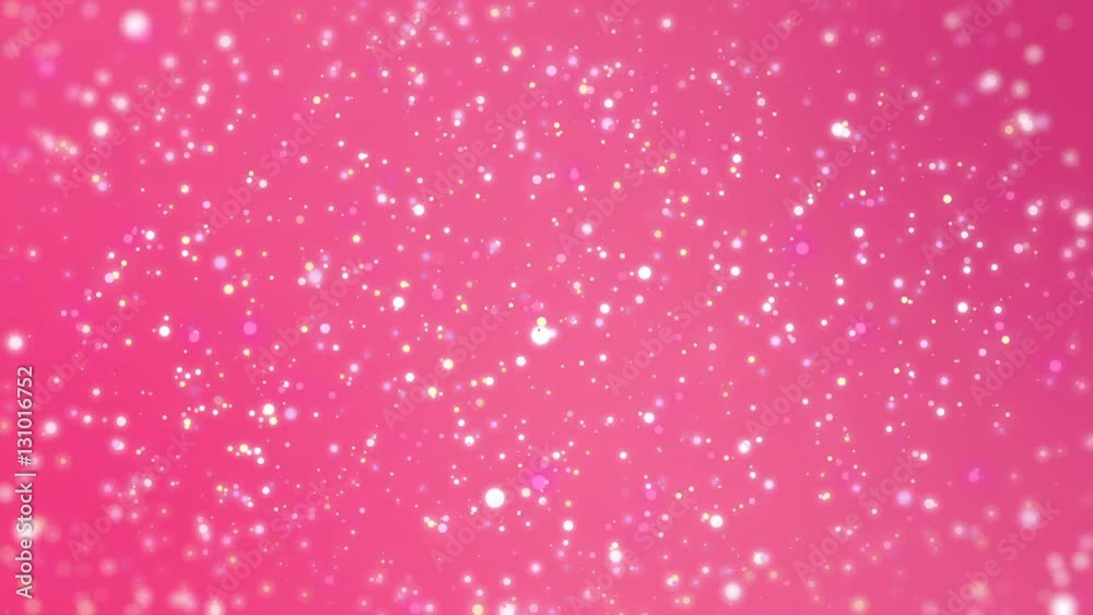 Valentines Day romantic dreamy pink glitter background with sparkling colourful particles and blurred edges.