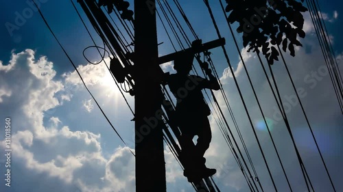 Silhouette Electrician wiring Newly on Pole