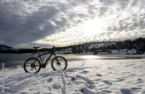 Cycling on lake. Winter
