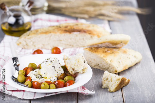 Italian focaccia with onion and basil photo