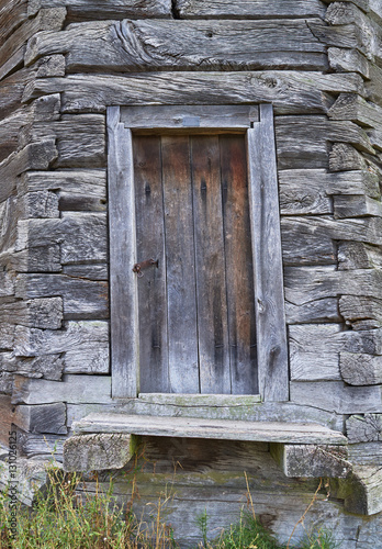 Facade of an old rickety wooden building photo