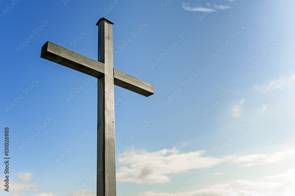 Wooden cross against blue sky