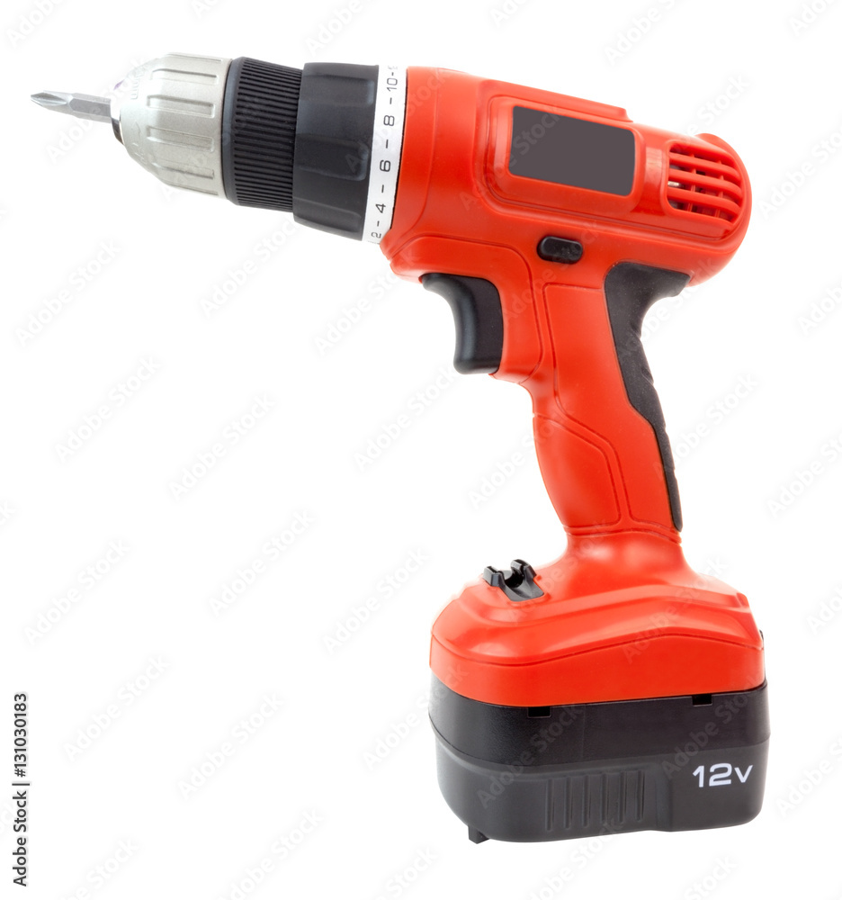 Side view of orange and black battery-powered hand drill. Isolated.	