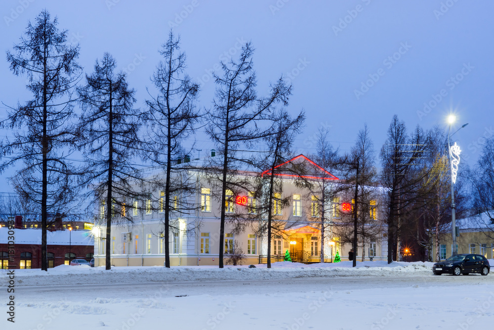 Old house decorated with illuminations for New Year Old house decorated with illuminations for New Year