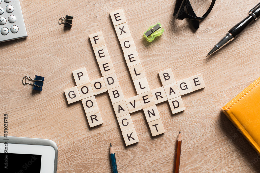 Conceptual business keywords on table with elements of game making crossword Conceptual business keywords on table with elements of game making crossword