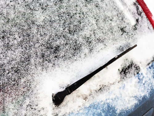 frozen rear window of car in winter