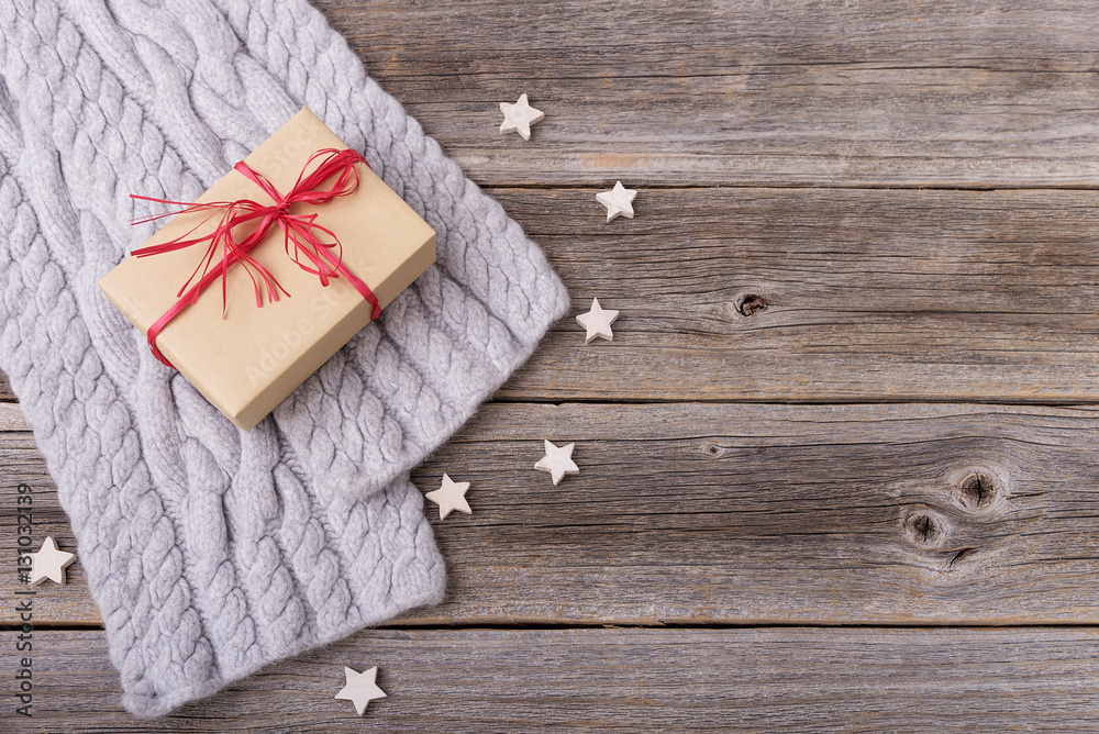 Gift box and scarf on wooden boards. Gift box and scarf on wooden boards.