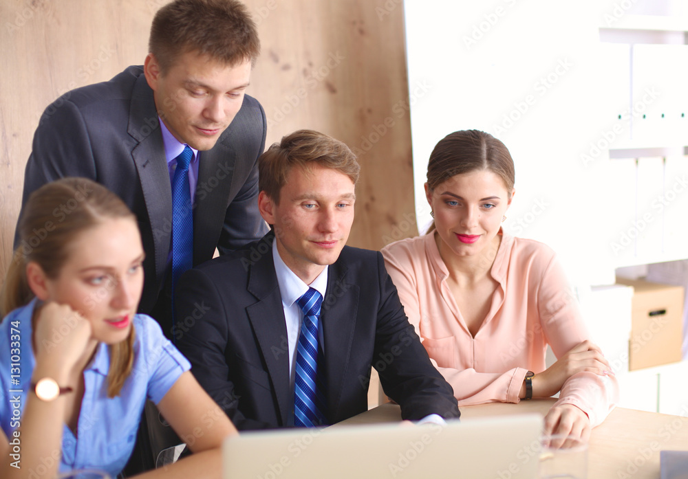 Business meeting - manager discussing work with his colleagues Business meeting - manager discussing work with his colleagues