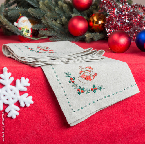 Fototapeta Naklejka Na Ścianę i Meble -  napkins embroidered with Santa Claus for Christmas