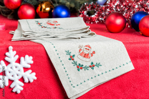 Fototapeta Naklejka Na Ścianę i Meble -  napkins embroidered with Santa Claus for Christmas