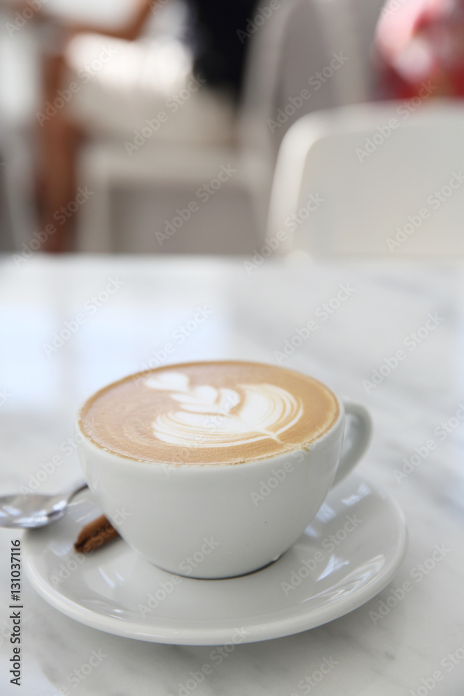 Obraz premium cappuccino coffee in white table
