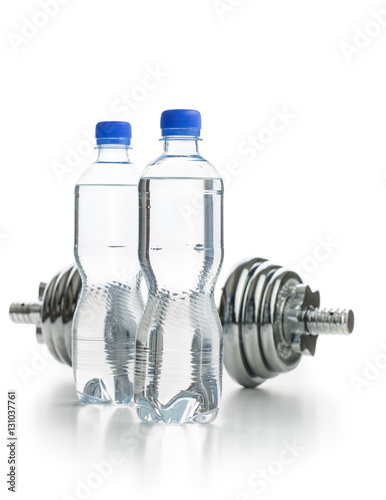 Bottle water and dumbbell.