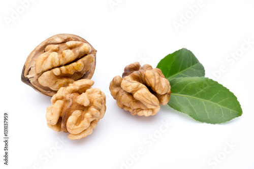 Walnut and walnut kernel isolated on the white background.