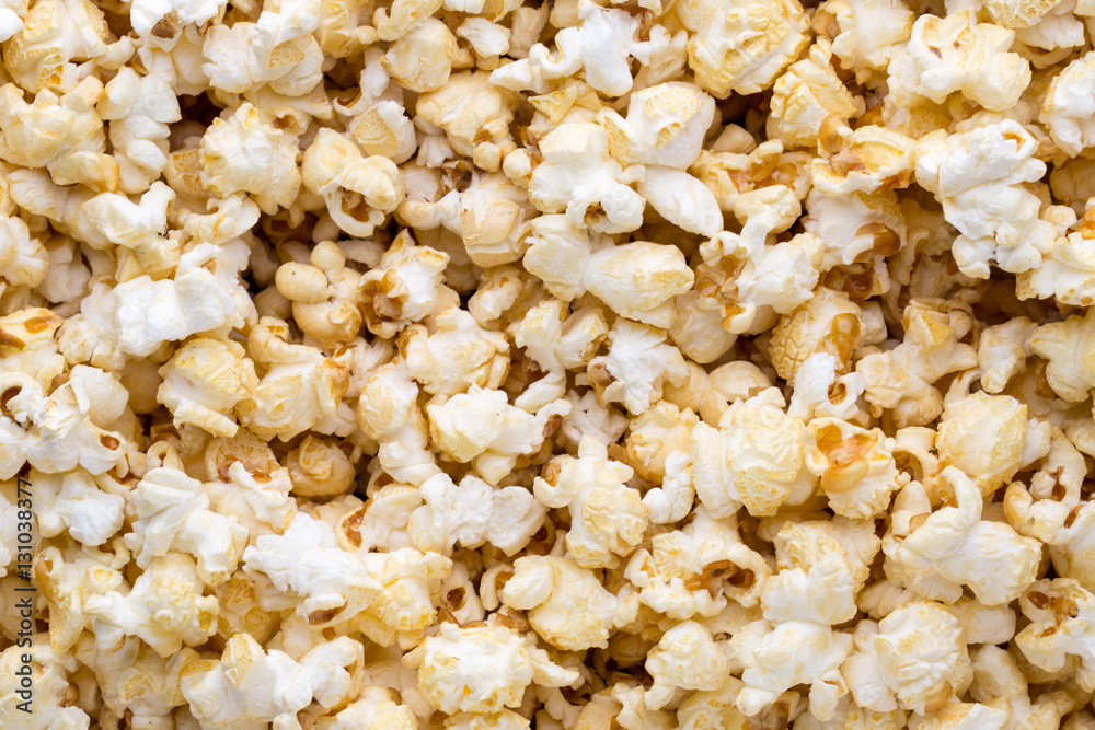 Popcorn background. Caramel sweet corn. Cinema snack.