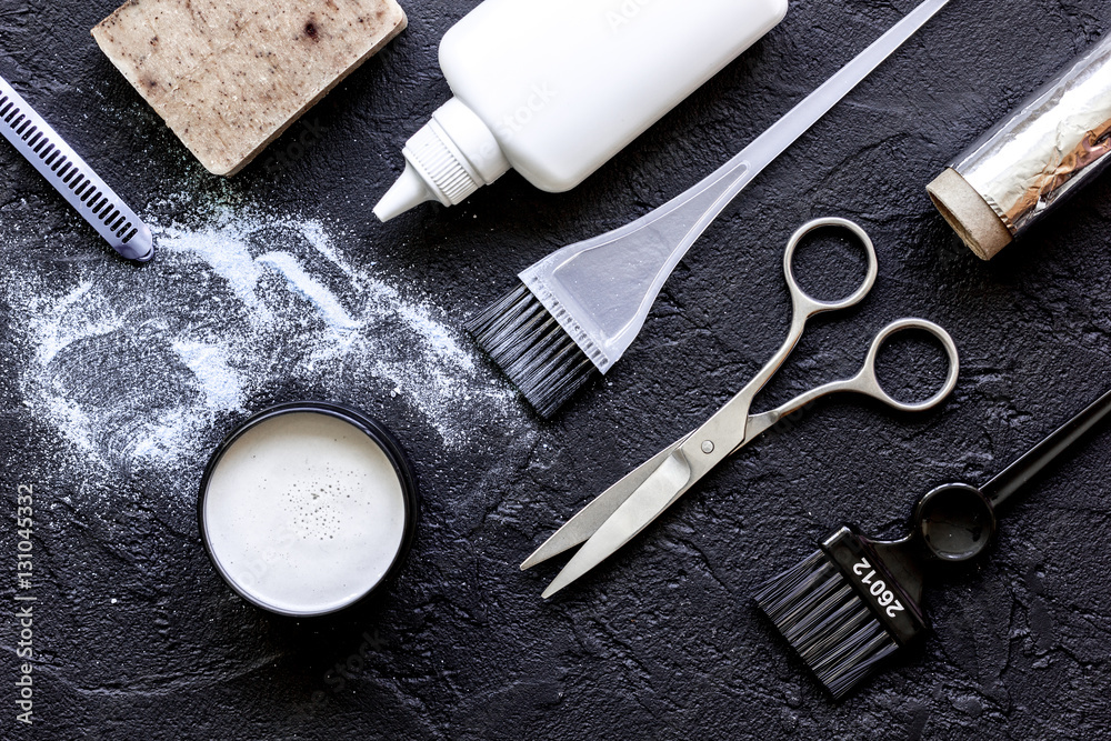 hair dye with brush on dark background top view hair dye with brush on dark background top view