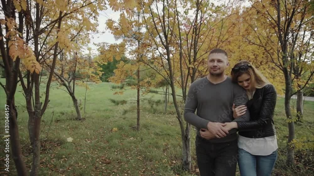 Couple walking in the autumn park HD Couple walking in the autumn park HD